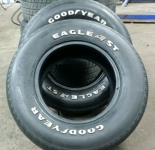 Pair.vintage.goodyear eagle st. raised letters. 215.70.14 collectible.good tread