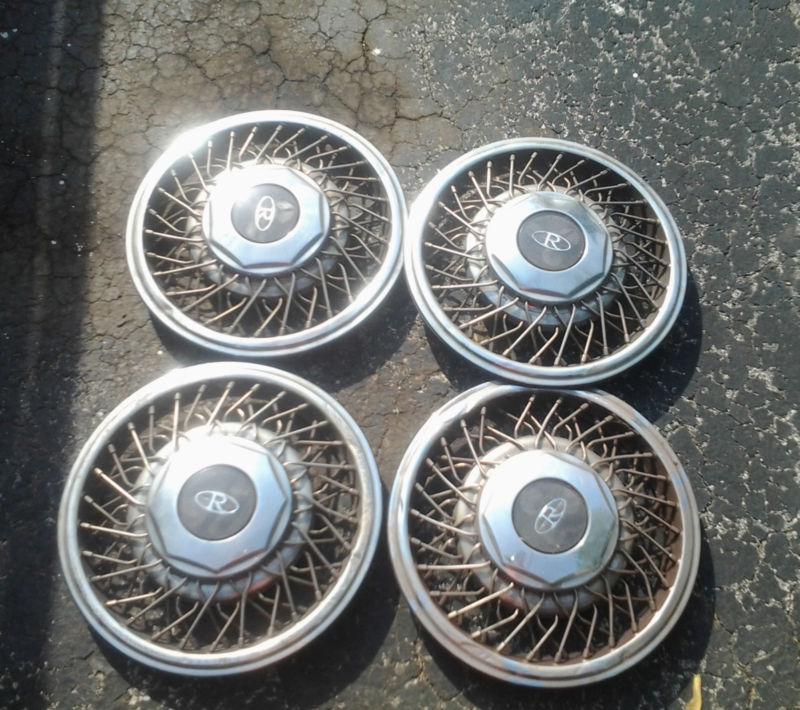 Buick riviera factory spoke hubcaps