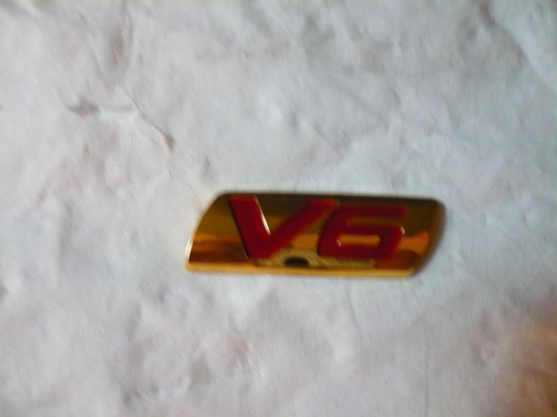 Honda accord gold / red emblem  "v6"  part #  08f20-sdn-100b