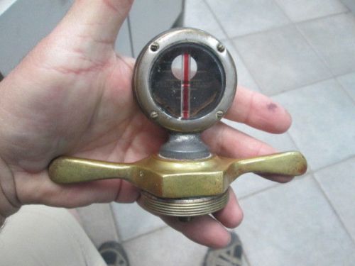 Small boyce moto meter with brass dog bone radiator cap hood ornament