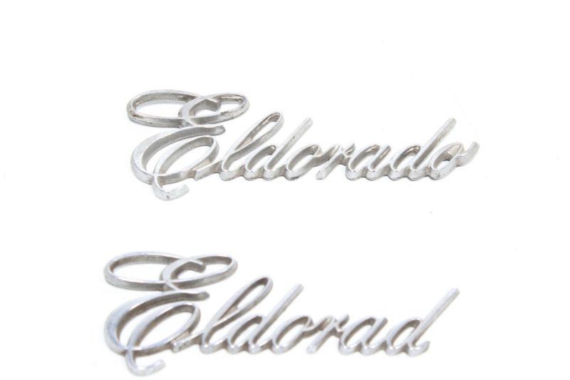 Two cadillac eldorado emblems
