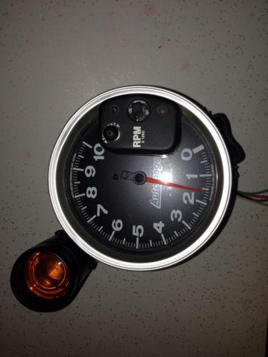 Auto meter auto gauge used 5" tachometer