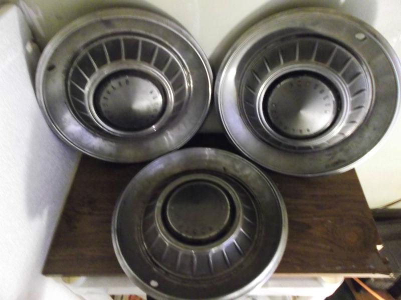 3 vintage chrysler hubcaps(hard to find)