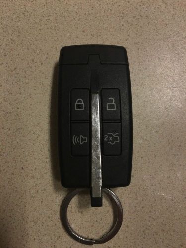 Remote key fob 4 button keyless 164-r7034 genuine ford fits taurus 2010-2011