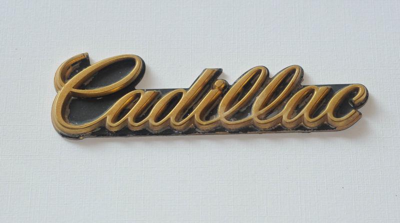 1989 cadillac brougham gold nameplate "cadillac" script emblem