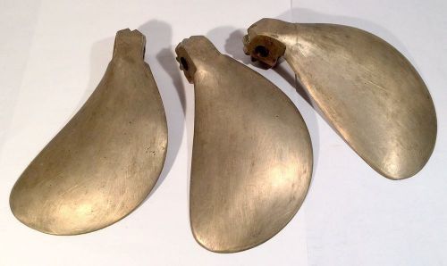 Three brass flex-o-fold boat propeller blades