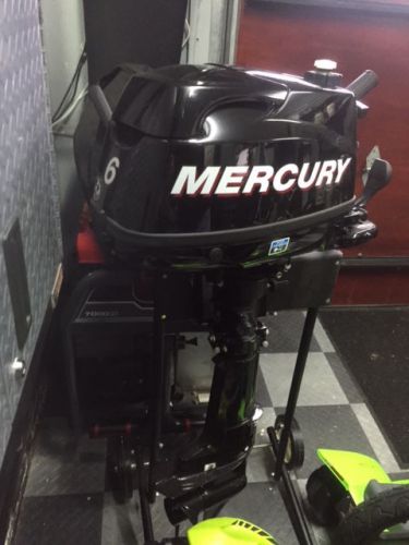 Mercury 6hp outboard motor 4 stroke. almost new w/stand