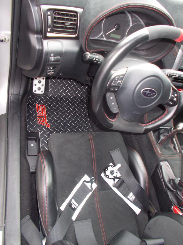Sti emblem inlayed floor mats.  black with exposed metal diamonds.  4pc set