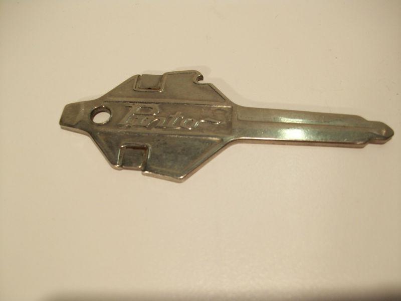 Ford pinto spark plug gapping gauge, shaped like a key.