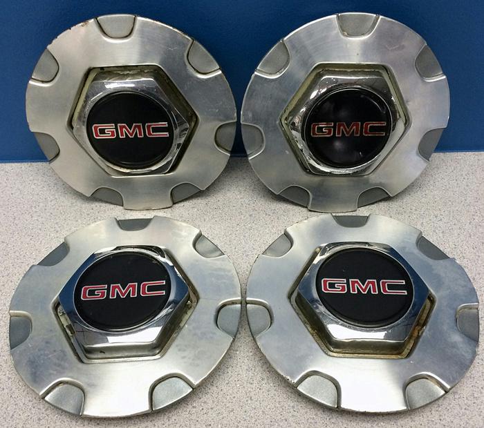 '98-05 gmc jimmy / sonoma / envoy 5064 7 spoke wheel center caps set/4 used