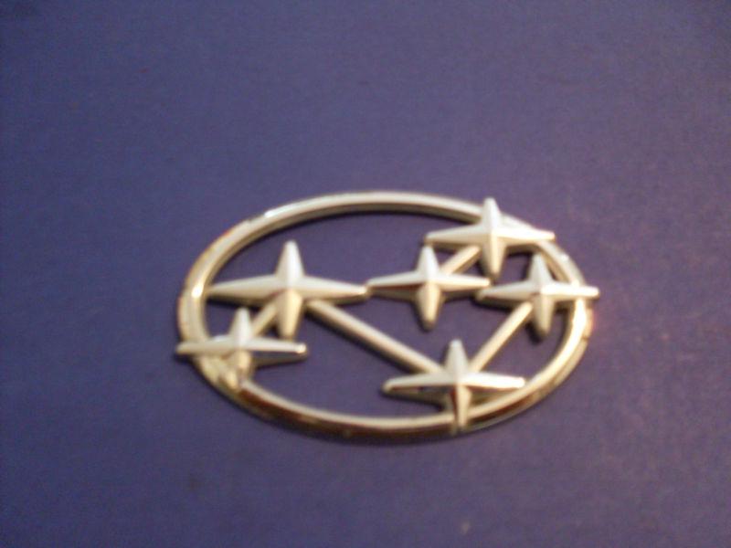 1990,s subaru/front or rear logo emblem/measures 3"7/8x2"1/2/6 stars in a group