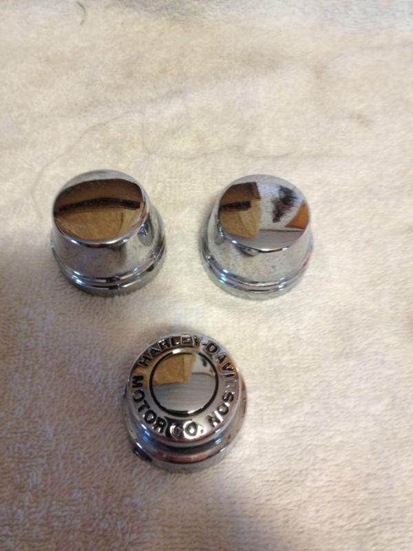Harley front chrome axle nut covers