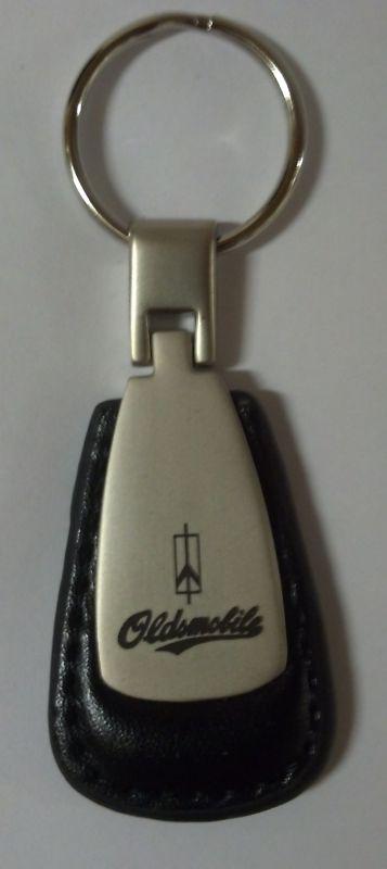 Oldsmobile teardrop keychain with leather surround/oldsmobile and insignia 