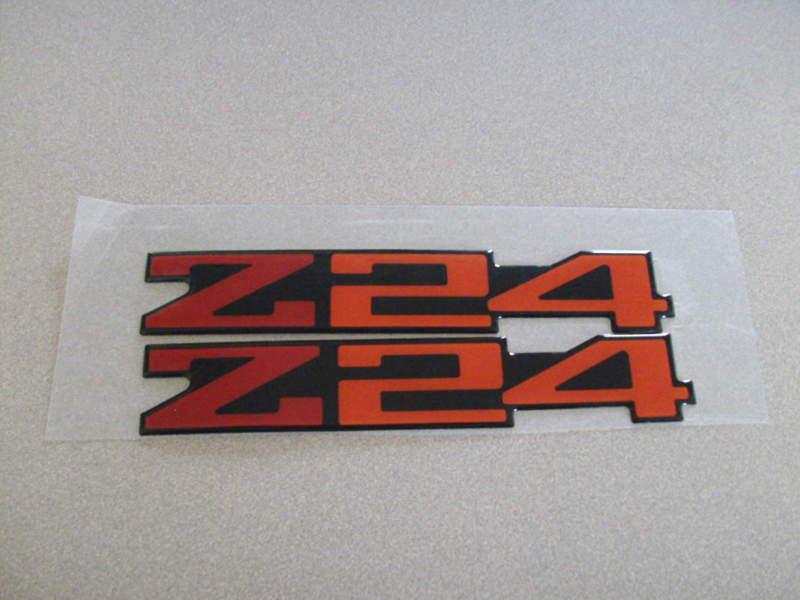 Nos oem chevrolet chevy cavalier z24 nameplate emblem 1988 - 1992 red and black