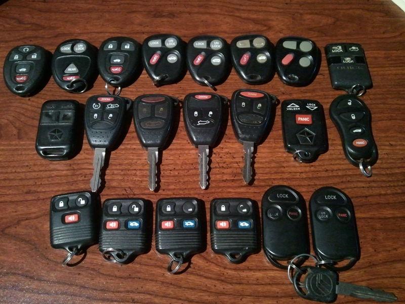 Lot of 21 used keyless remotes gm, ford, chrysler 