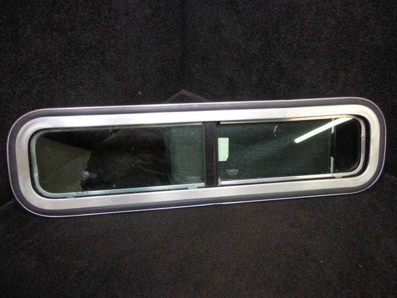 Model #873-4749a - sliding boat window - measures 28" long & 6-5/8" high 