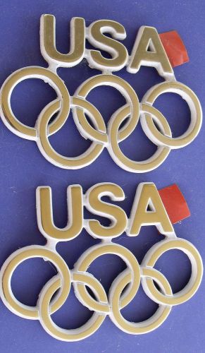 Buick regal olympic rings emblems pair gold/white new nos oem 84 badge usa