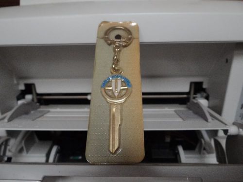 Oldsmobile rocket key blank uncut new in orig package vintage keychain 1967-1990