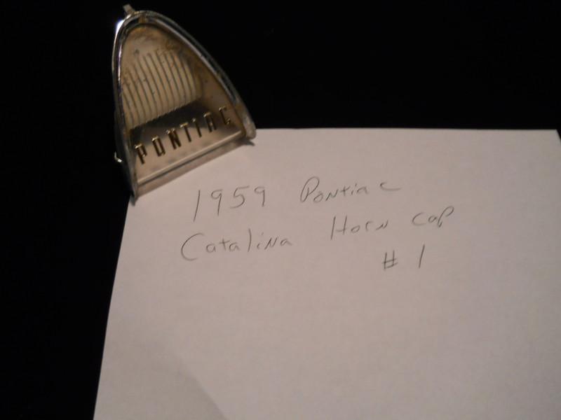  original two (2)1959 pontiac catalina horn cap used: fair condition