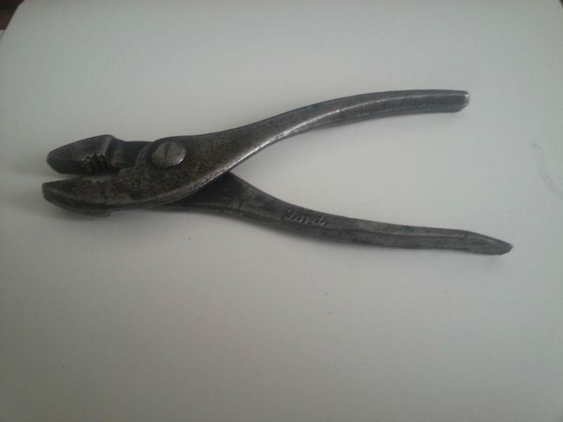 Ford script pliers and model t headlight lens