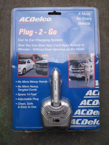 Nos ac delco plug 2 go car battery charger - sealed package