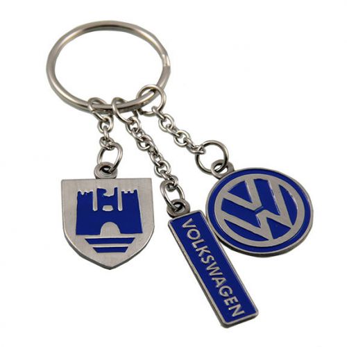 Vw keyring features the wolfsburg crest, vw logo, and the word volkswagen