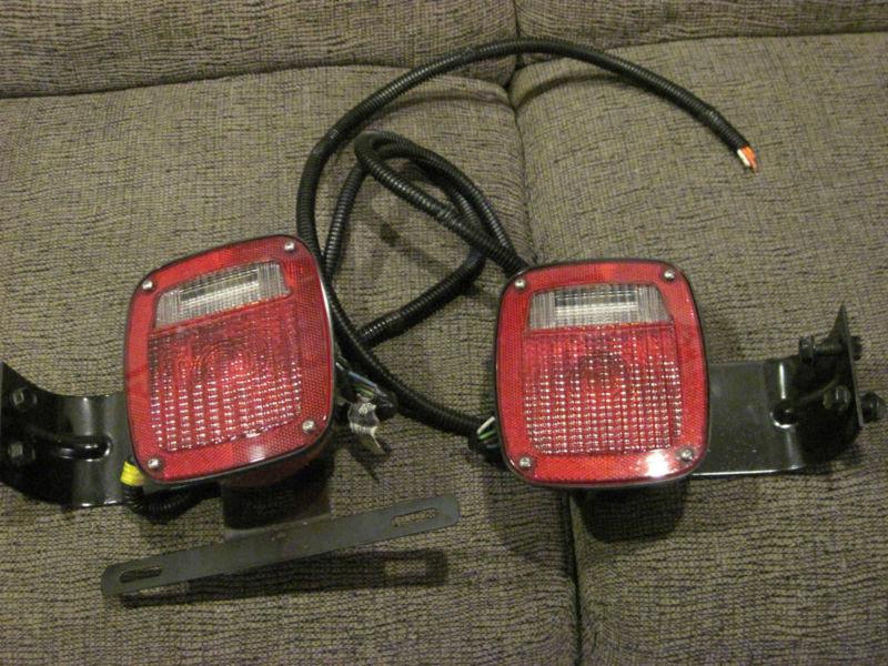 Universal tail lights with back up lights