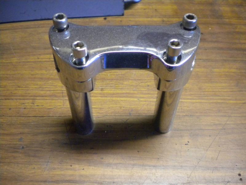 Handle bar clamp risers chrome