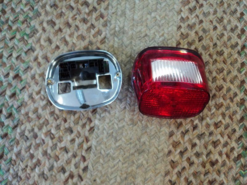 Harley davidson tail light and backing plate..with plug
