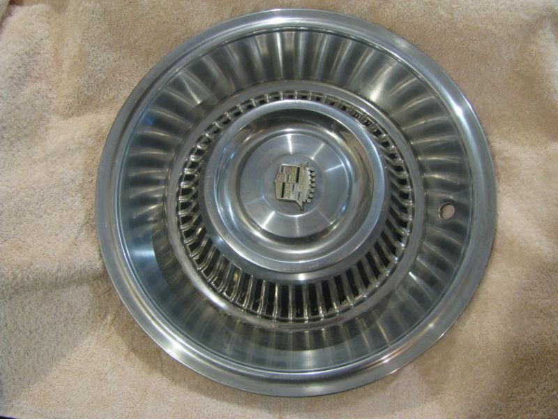Four 1963-64 cadillac eldorado hub caps