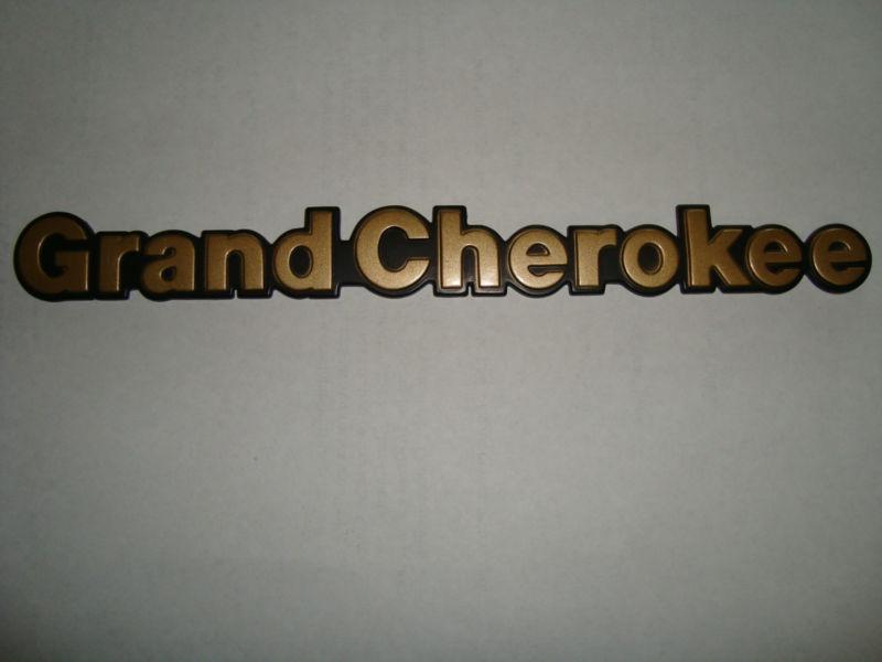 Jeep grand cherokee emblem gold