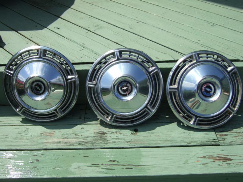 Three chevy hubcaps 1975-88 15"  nice! 