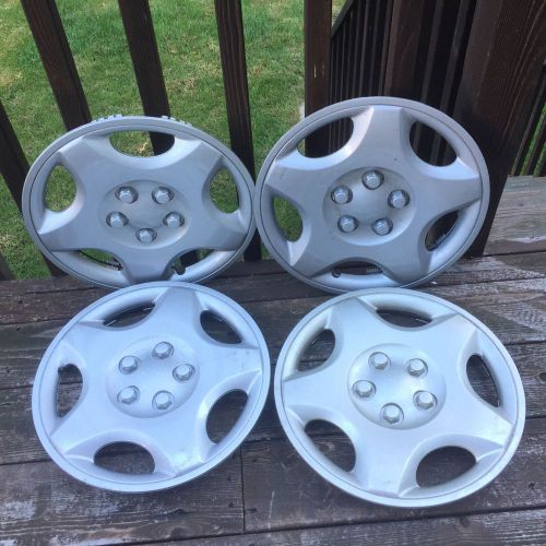 New set of four (4) 1997 to 2000 dodge stratus caravan 14 inch hubcaps free s&amp;h