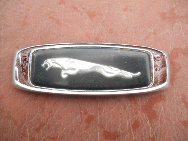 Jaguar plastic left face fender emblem pin style b  driver quality