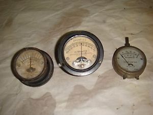 2 test equipment gauges and a small hand-held tester