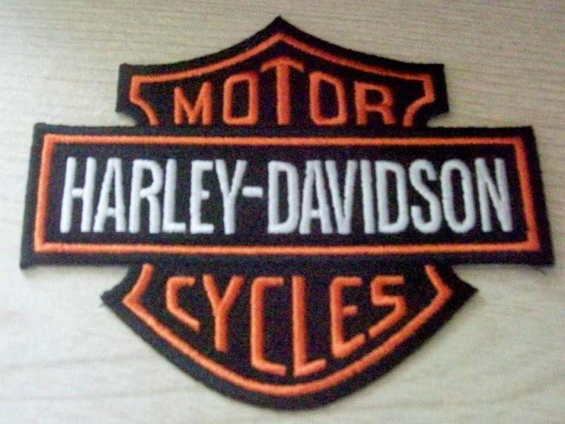 Harley davidson new shield patch in black, white, and orange