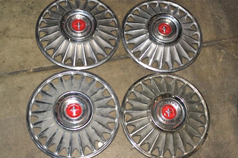 Set of (4) 14" spoke mag hubcaps w/ red center caps - fits mustang 1965-67