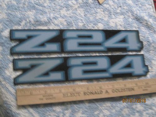 Nos 1980s chevrolet cavalier blue z/28 stick on emblems-2 pieces