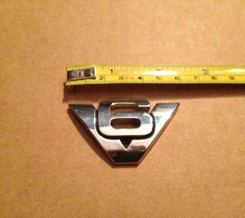 Used oem "v6" emblem for 2001-2005 ford escape & mercury mariner models