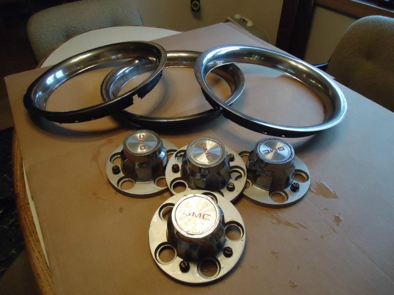 Purchase Gmc center caps with half the mounting screws plus three