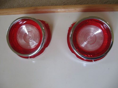 1965 chevy bel air backup light lenses with ornaments. pair! new! glo-brite.