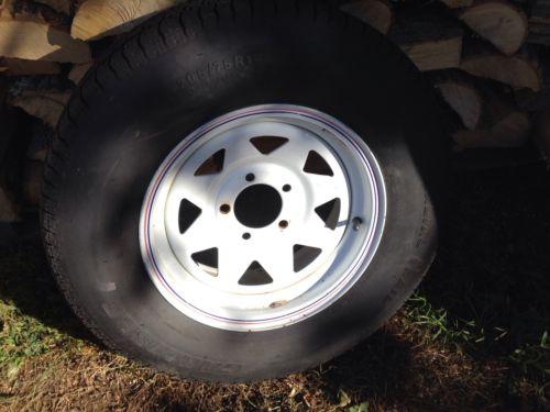 14" trailer tire and rim st205/75r14 never used mounted on trailer as spare