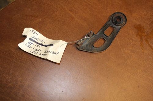 84 suzuki lt 185 headlight bracket left side