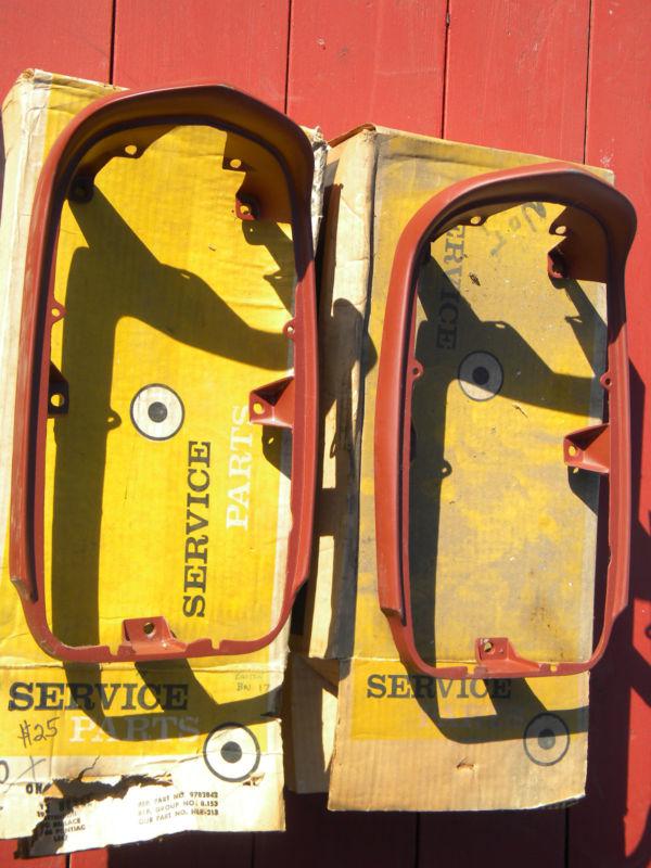 Pair of boxed n.o.s. left & right 1966 pontiac catalina headlight frame  bezels