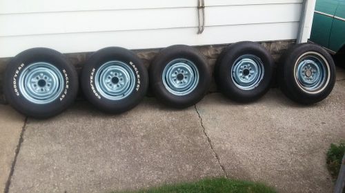 1957 chevy wheels,tires and hubcaps, with extra wheel and tire for spare. rally