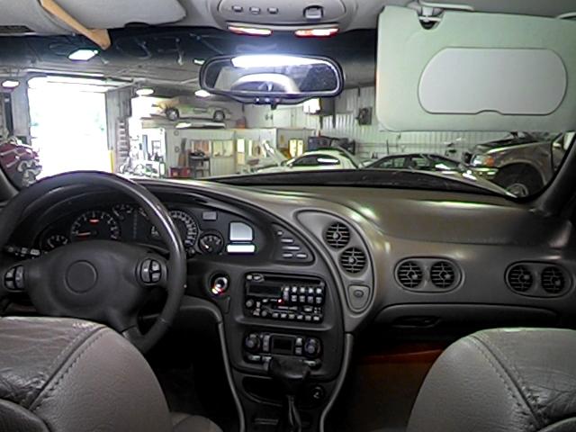 2001 pontiac bonneville speedomter and radio trim dash bezel 2587367