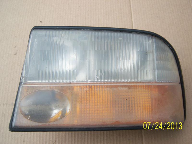 Purchase 2000 GMC Jimmy left side headlight assembly in Osseo