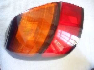 2000-2004 subaru outback wagon lh tail light cover (used)