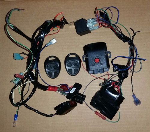 Karr alarm system with 2 remotes and trunk release