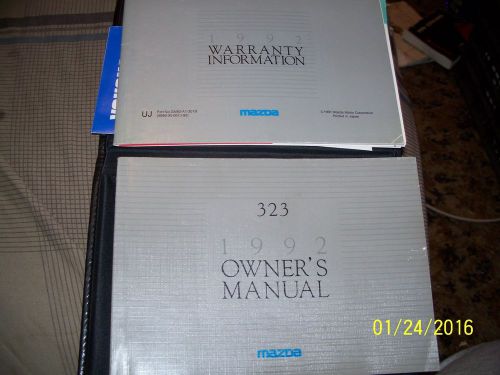 A owners manual&amp;other manuals for a 1992 mazda 323 with vinyl case